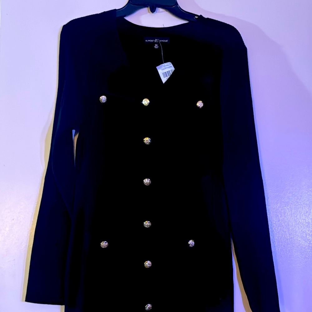 Black ribbed knit dress with golden buttons